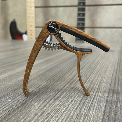 Aluminum Trigger Capo: Dark Wood Grain