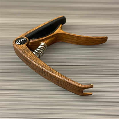 Aluminum Trigger Capo: Dark Wood Grain