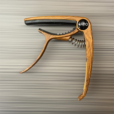 Aluminum Trigger Capo: Dark Wood Grain