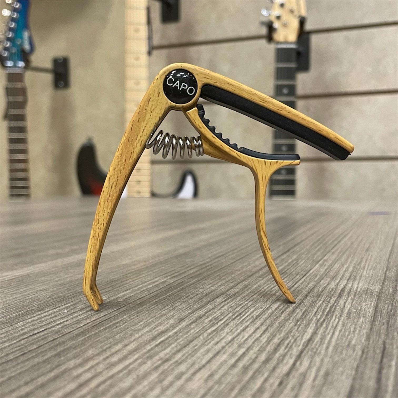 Aluminum Trigger Capo: Light Wood Grain