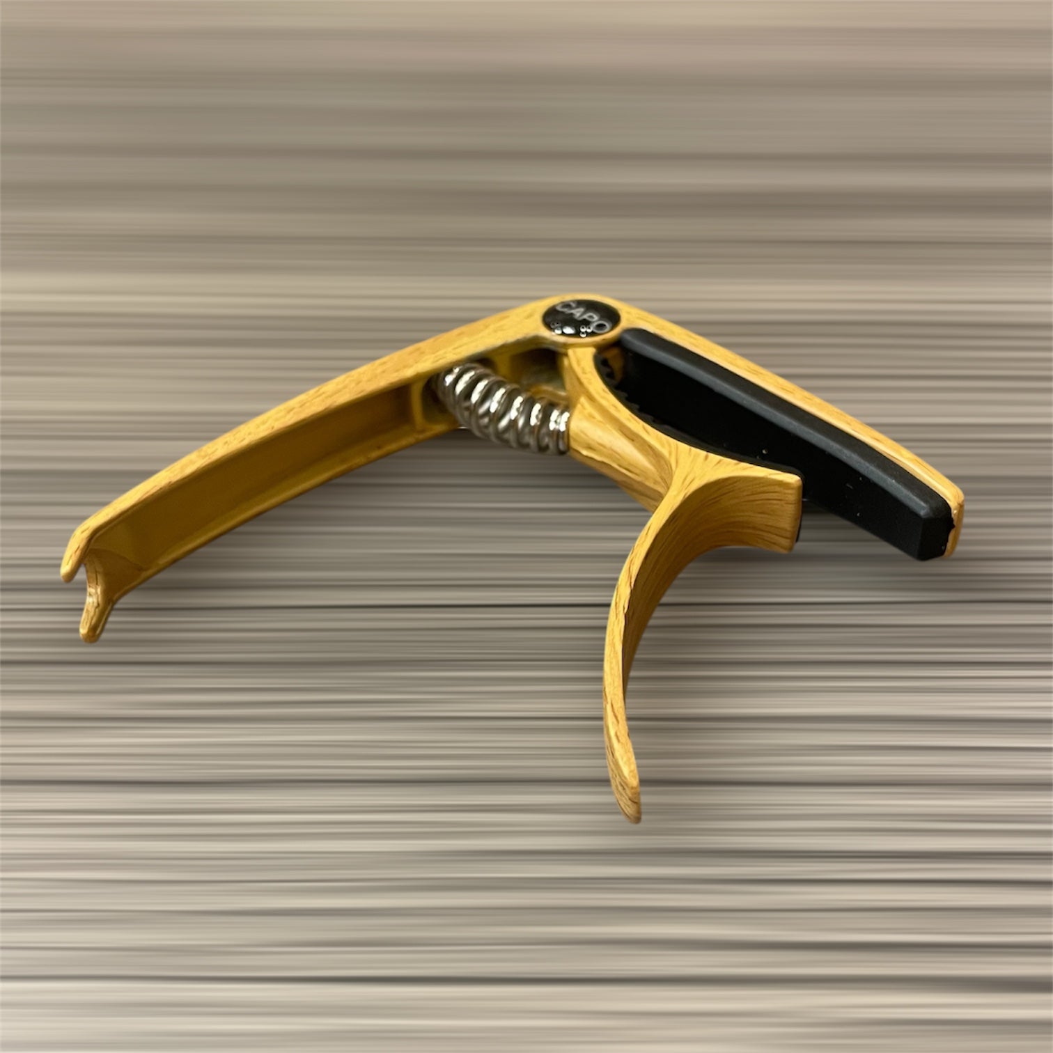 Aluminum Trigger Capo: Light Wood Grain